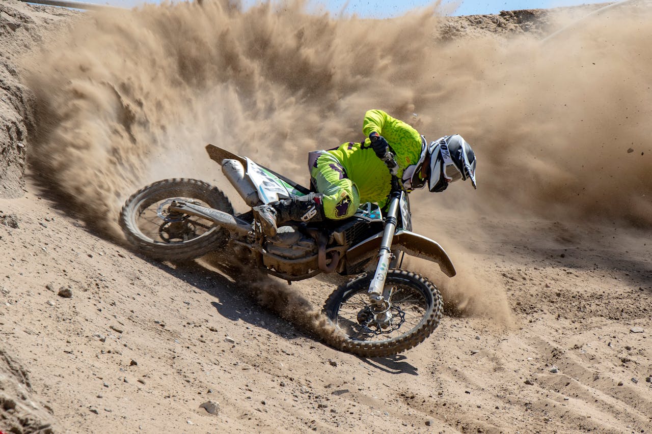 Thrilling dirt bike action in Cape Town's desert landscape. High-speed motocross adventure captured.